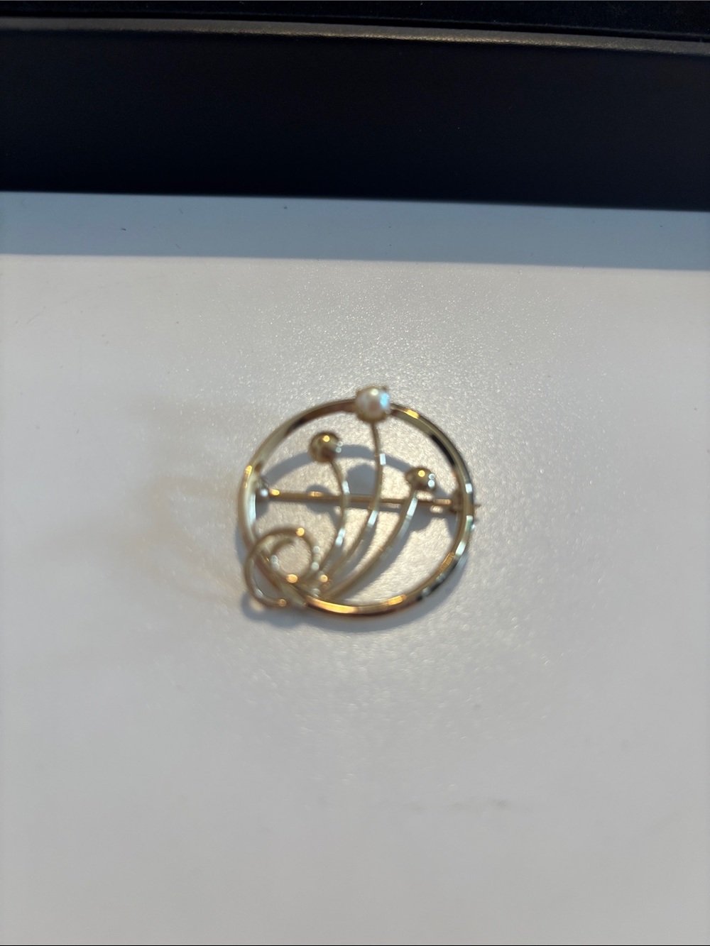 Stamped CR Co. stands for Charles Reiss Circular Floral Motif Brooch